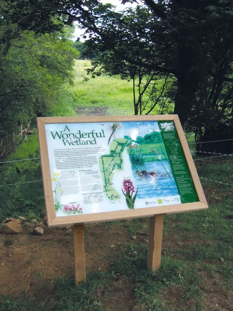 A Wonderful Wetland Wildlife Information display mounted in a wooden frame, West Leas Farm Nidderdale